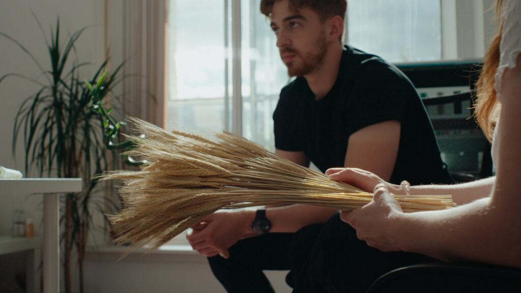 A still shot from the video series of S'wheat owners holding wheat.